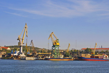 Fototapeta na wymiar Dock crane towers in Savestopol bay, Ukraine
