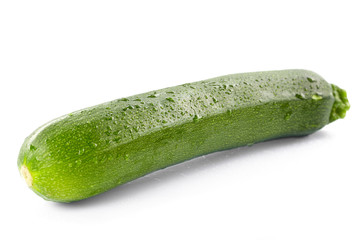 green zucchini on the white background..