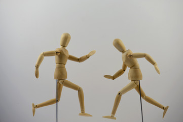 Two mannequins positioned into a hurrying posture