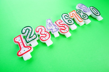 Birthday candles against colourful background