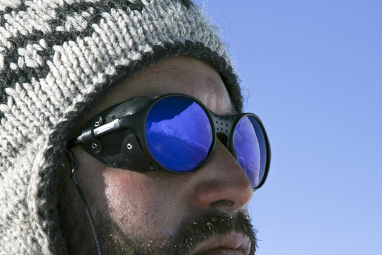 Reflection in the sunglasses of a mountaineer on Antarctica