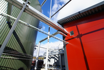 Pipes, tubes, machinery and steam turbine at a power plant.