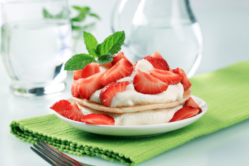 Pancakes with curd cheese and strawberries