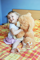 little girl with soft  toy