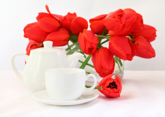 tea cup and red tulips