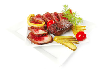 meat chunk and slices on plates