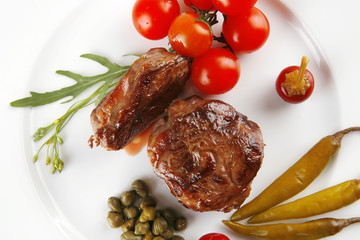 grilled meat medallion with cherry tomatoes