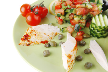 grilled chicken meat drumstick served green