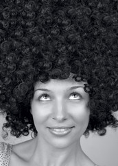 Happy woman with trendy curly hair style