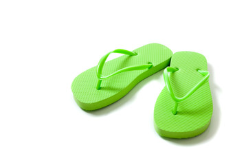 Colored flipflops on a white background