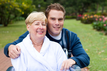 sick mother with son in park