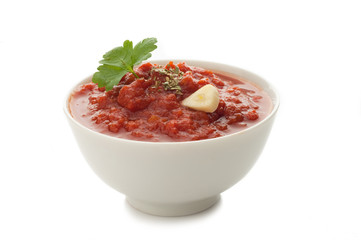 bowl with cooked tomato sauce with garlic, parsley and oregano