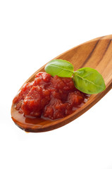 cooked tomato sauce with basil over the spoon