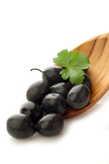 black olives over the spoon
