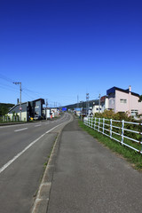Fototapeta na wymiar Roadway to town in Hokkaido