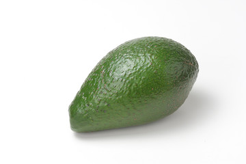 Green avocado isolated on white