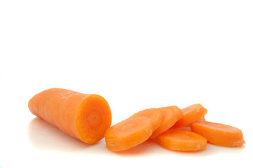 Partially sliced carrot.