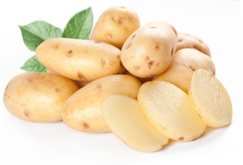 Yellow potatoes with leaves on a white background