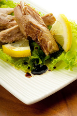 tuna with salad lemon and balsamic vinegar on dish