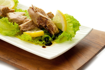 tuna with salad lemon and balsamic vinegar on dish