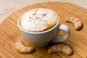 fresh cappuccino in the Cup with Cookies