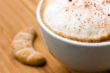fresh cappuccino in the Cup with Cookies