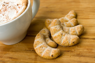 fresh cappuccino in the Cup with Cookies