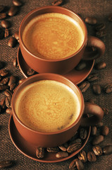 Cups of coffee and coffee beans