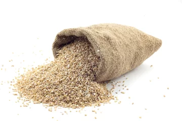 Fotobehang small bag of wheat grains © Buriy