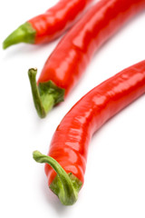 three red chili peppers