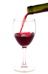 Red wine pouring from a wine bottle