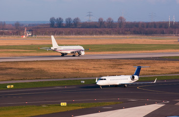 Jet plane taking off while another one waits to take off
