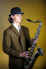 portrait of young retro man playing saxophone