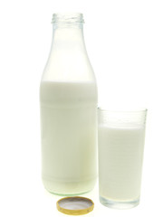 bottle and glass of fresh milk on white background