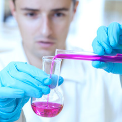 young male researcher carrying out scientific research experimen