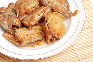 a dish of broiled hairtail on the table