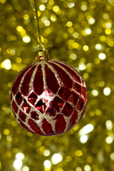 macro of a christmas ball in front of blur background