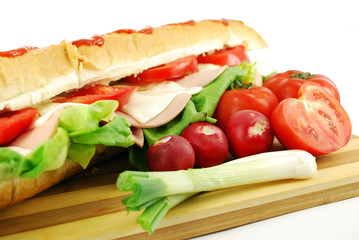 big sandwich and vegetables