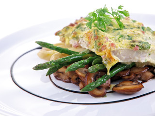 baked fish & asparagus gratin isolated on white background