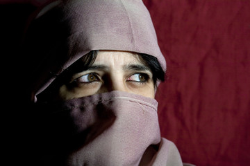 Woman's face covered by burka
