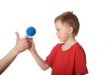 Little boy and a hand puppet with balls
