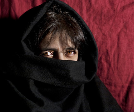 Woman's face covered by burka