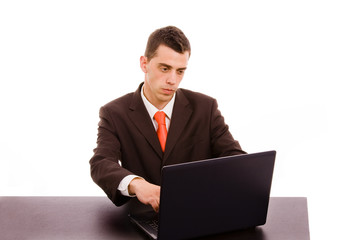 business man working on a laptop computer at the office