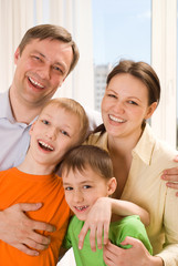 Fototapeta na wymiar happy parents with two children