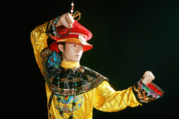 one asian man is wearing a dragon robe