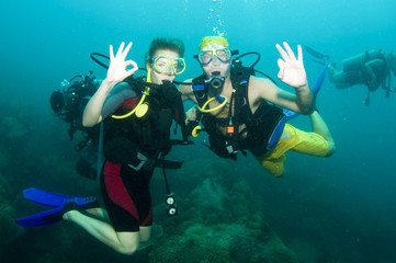 two scuba divers on a dive