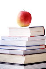 concept éducation: pile de livres avec pomme et lunettes