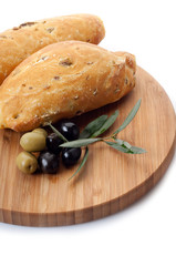 italian olive bread over cutting board