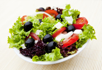 salad in plate on mat