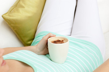 Close-up of a woman drinking a coffee